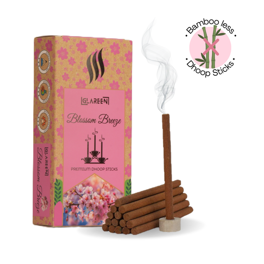 A pack of incense sticks labeled 'Blossom Breeze' with a visual indication of a bamboo-free product. The image also includes a lit incense stick producing smoke, suggesting the release of aroma.